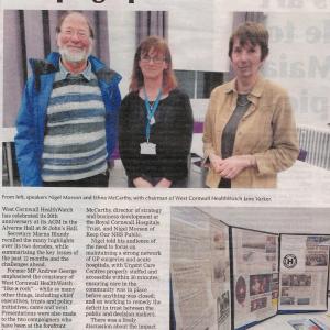 Presscutting: Campaign passes milestone. Picture Nigel Morson (bearded man in blue coat) Ethna McCarthy (long haired woman in black and Jane Varker (short haired woman in tan jacket) Picture of display boards. West Cornwall HealthWatch celebrated its 20th anniversary at its AGM...